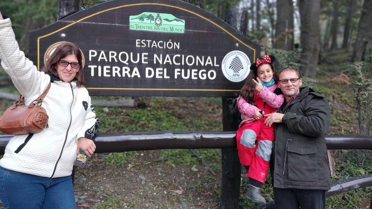 The End of the World Train steaming through the Pipo River valley with coaches full of visitors on the excursion from Ushuaia, Argentina