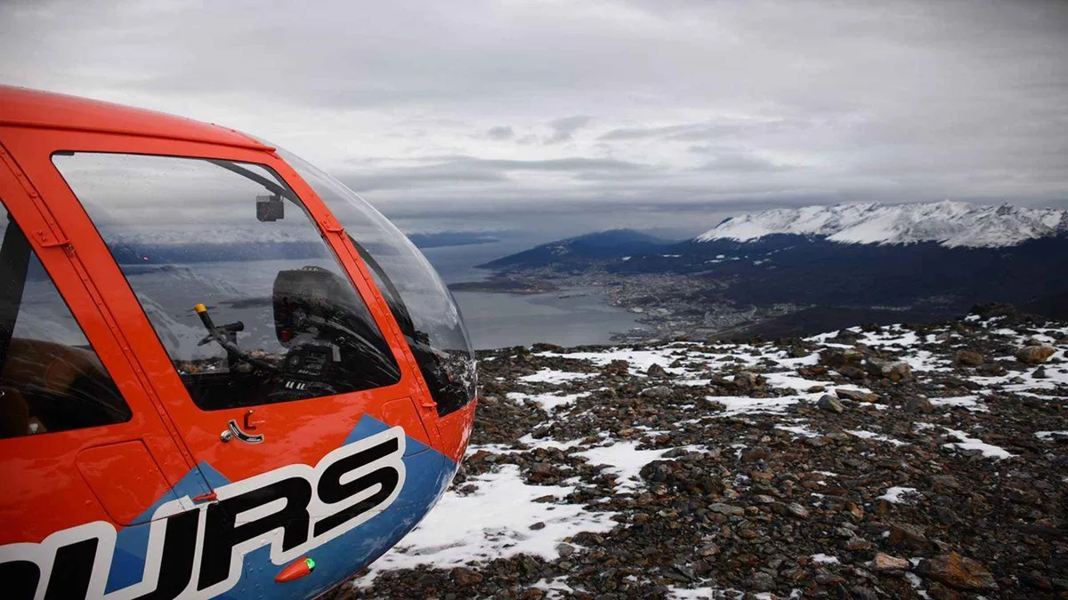 Helicopter banking over the Beagle Channel with the city of Ushuaia below, Argentina