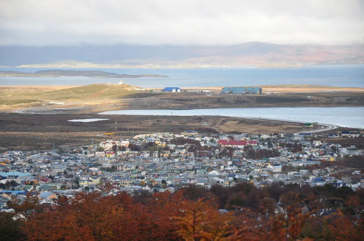 View over the rooftops and port of Ushuaia with the Beagle Channel behind, Argentina
